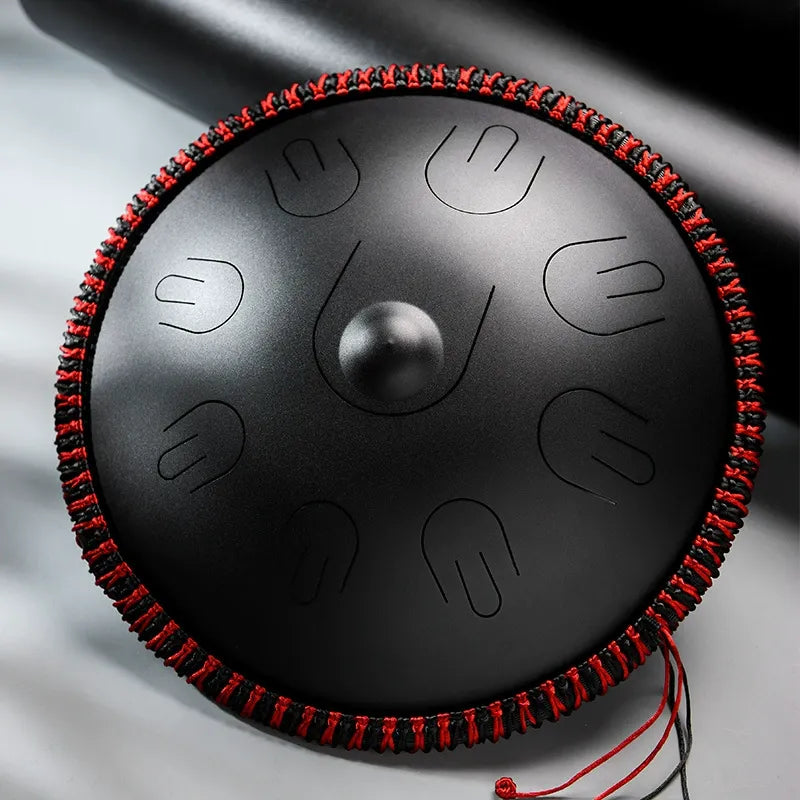 A deep Abyssal Void MoralGain Legacy 16-inch 9-note handpan-style steel tongue drum. The ultimate instrument for a rich, layered sound.