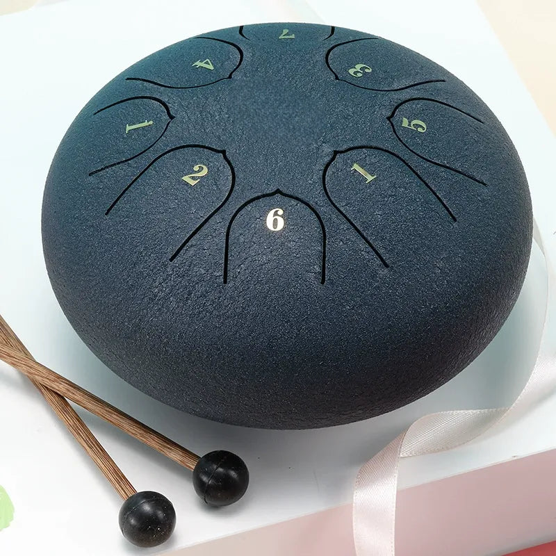 A vibrant, deep ocean blue 6-inch 8-note steel tongue drum, a portable healing instrument.