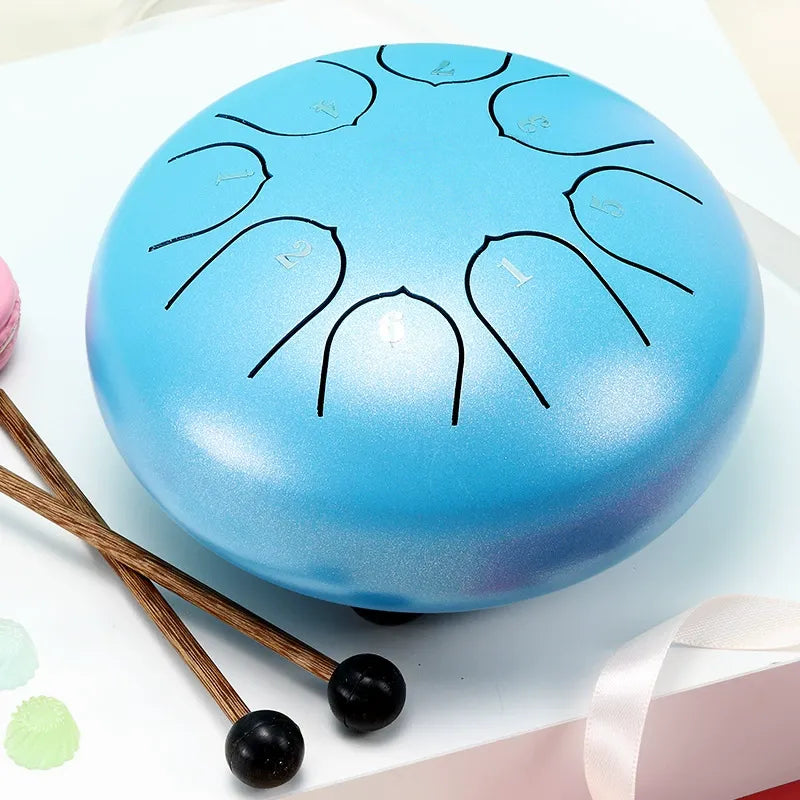 A peaceful, serenity blue 6-inch 8-note steel tongue drum, a beginner-friendly handpan for relaxation.