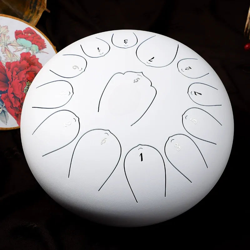 A serene, cloud-white MoralGain 12-inch 13-note steel tongue drum, perfect for sound therapy and deep meditation.