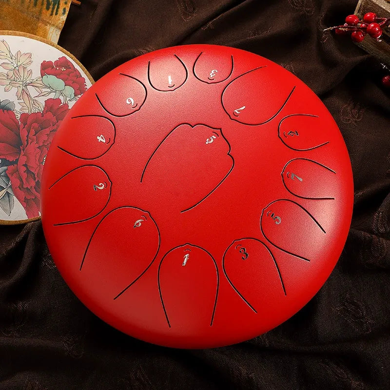 A bold, crimson red MoralGain 12-inch 13-note steel tongue drum, a beautiful and vibrant percussion instrument.