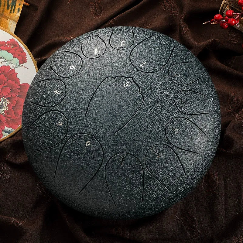 A vibrant, deep ocean blue MoralGain 12-inch 13-note steel tongue drum, a portable healing instrument.