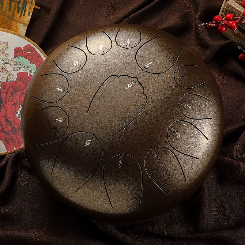 An elegant, vintage bronze MoralGain 12-inch 13-note steel tongue drum, a professional-grade handpan instrument.