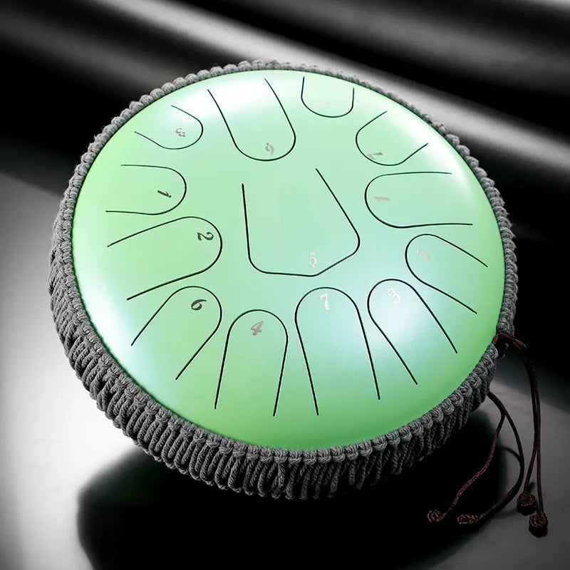A deep Mountain Mist Green MoralGain 13-inch 15-note titanium steel tongue drum. An exquisite handpan for a truly immersive sound experience.