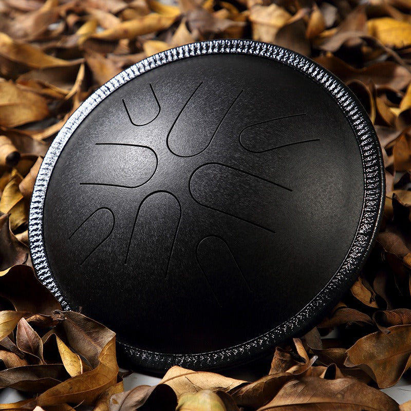 The Obsidian Swirl MoralGain Legacy 10-inch 8-note portable handpan, featuring a unique textured finish that makes each piece one-of-a-kind.