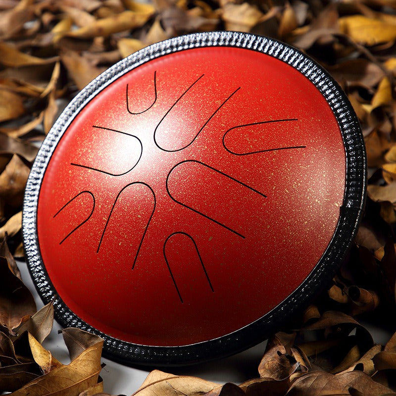 The Twilight Crimson MoralGain Legacy 10-inch 8-note portable handpan, its stunning hue reminiscent of a beautiful sunset.