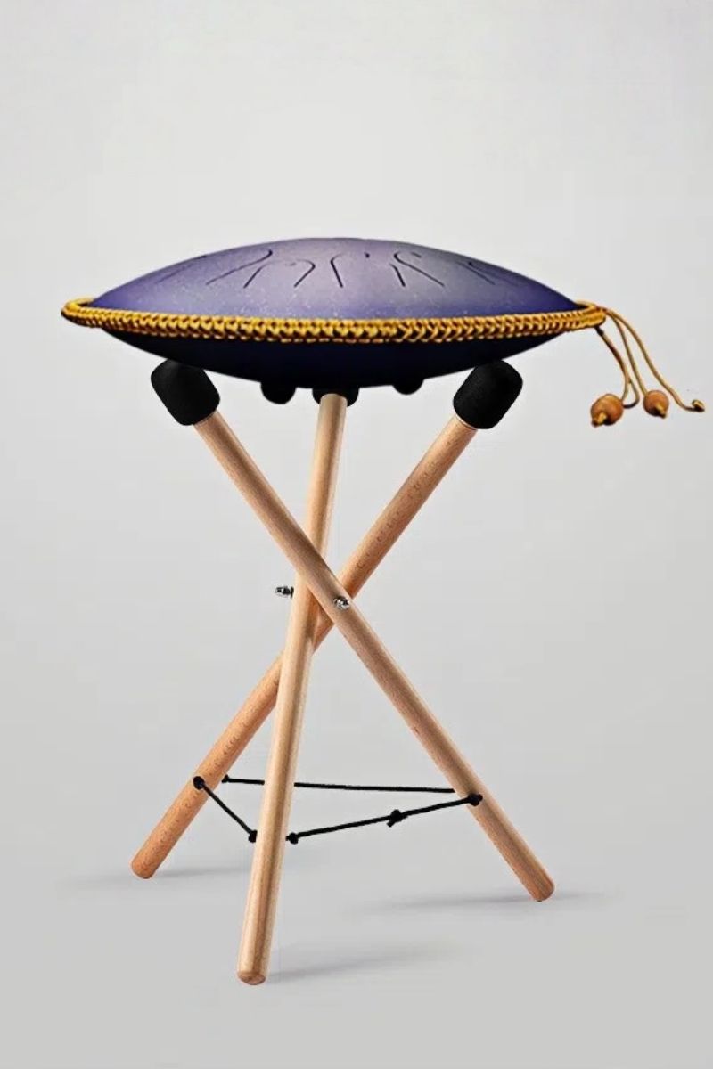 A complete view of the MoralGain Legacy handpan on its display stand, with mallets, showcasing its elegance and readiness for both play and exhibition.