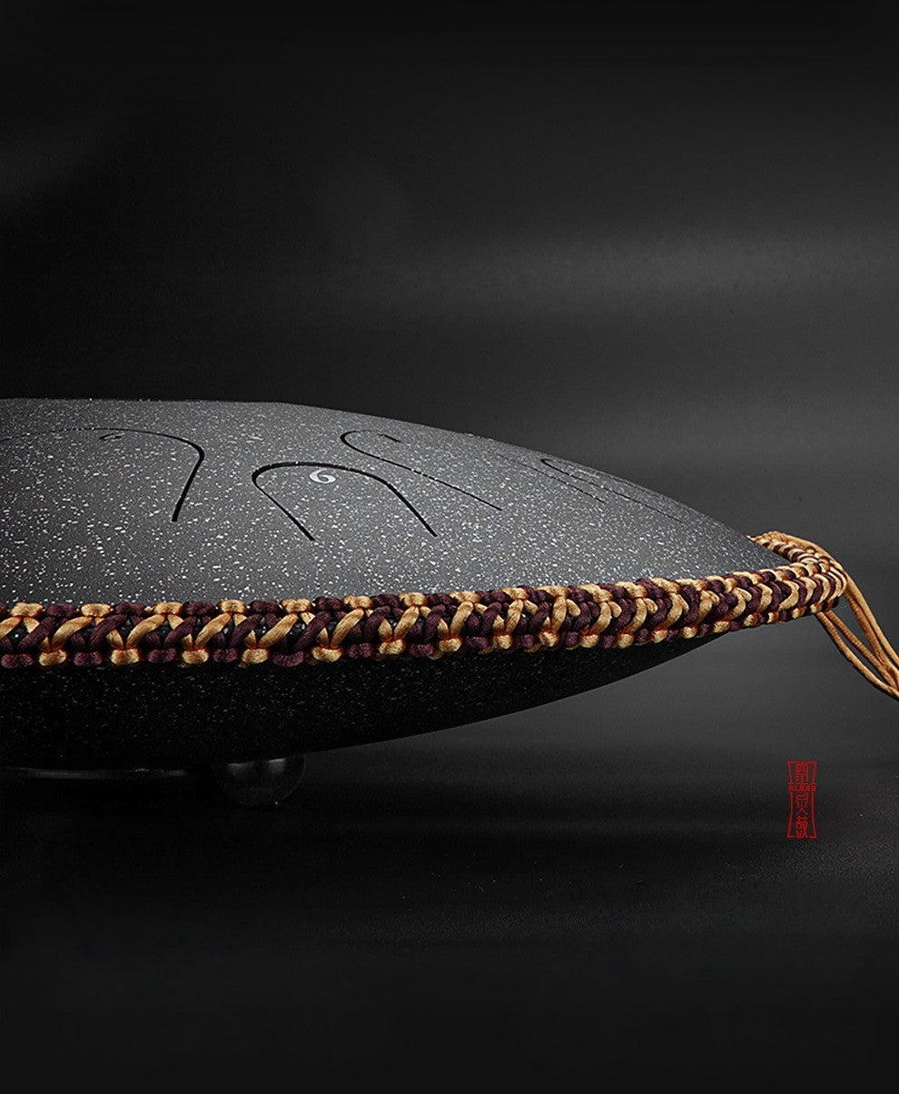 A detailed shot of the MoralGain Legacy handpan's precisely tuned notes, highlighting the meticulous craftsmanship and the exceptional quality of its sound.