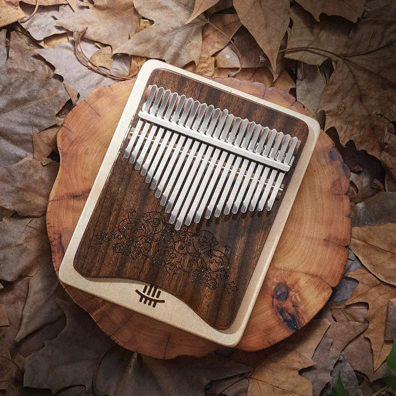 A close-up of the MoralGain® Master kalimba, showing the rich grain of the walnut and maple combination and its warm tonal characteristics.