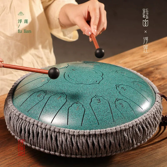 Product image of a steel tongue drum, a unique percussion instrument known for its ethereal and soothing sounds.