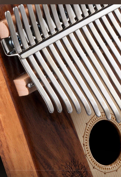 An artistic shot of a wooden thumb piano with sunflower art and rich wood textures, paired with dried leaves and a tree-ring pedestal in soft lighting, representing a peaceful wellness gift concept.