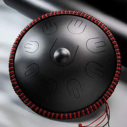 A deep Abyssal Void MoralGain Legacy 16-inch 9-note handpan-style steel tongue drum. The ultimate instrument for a rich, layered sound.