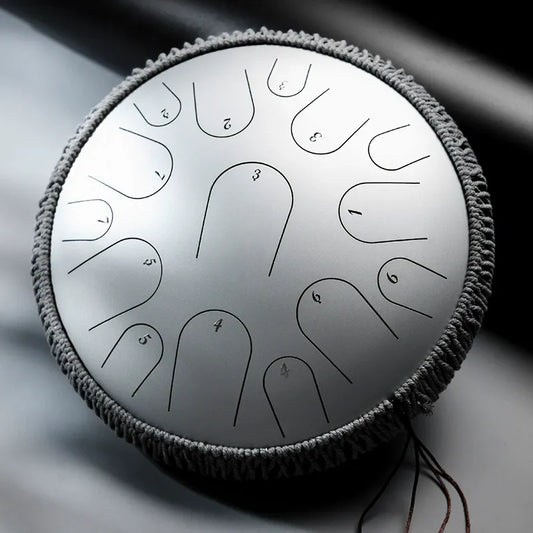 A stunning Stellar Silver MoralGain Master 14-inch 15-note titanium gold steel tongue drum. Its cosmic glow reflects a studio-grade, pure sound for professional musicians.