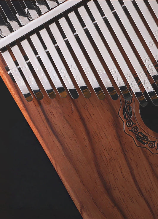 Professional MoralGain® Master 21-key resonant box kalimba crafted from Gaboon Rosewood, featuring a front-facing sound-hole and ergonomic round-edge design for deep acoustic resonance.
