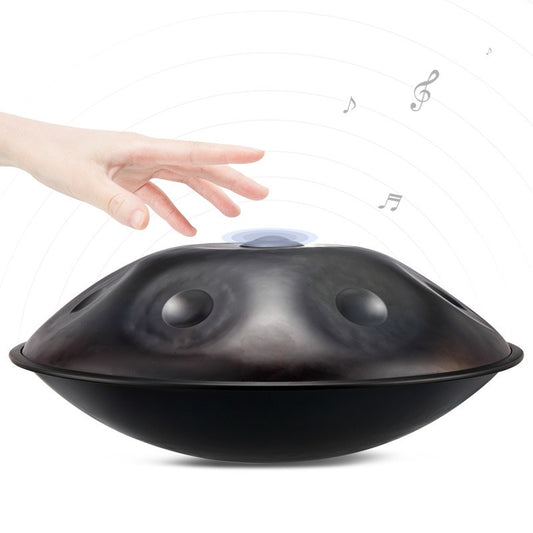 A person playing a MoralGain® Master Patina Bronze handpan in a cozy indoor space, highlighting its refined aesthetic.