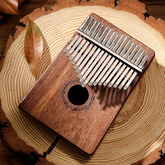 A MoralGain® Pro 17-key kalimba made of walnut wood, showcasing its rich color and fine grain. This professional instrument is ideal for beginners.