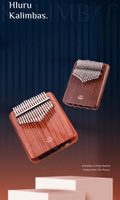 A studio-grade MoralGain® solid wood electric thumb piano on a dark tabletop, showcasing its sleek black walnut body and smart pickup system designed for professional stage performance and recording.